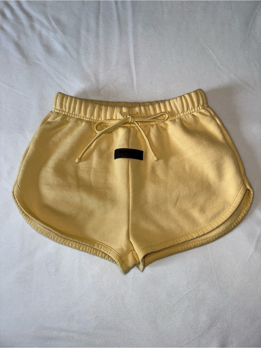 Fear of God ESSENTIALS Butter Yellow Fleece Dolphin Sweat Shorts XS